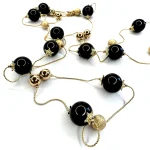 Collana lunga dorata con sfere